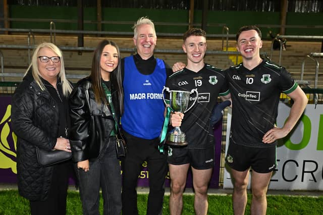 Rock joint manager Adrian Nugent celebrates with his sons Odhran and Liam Nugent and the family after in the Tyrone Intermediate Championship Final replay Rock v Pomeroy, at Dungannon , Co. Tyrone.