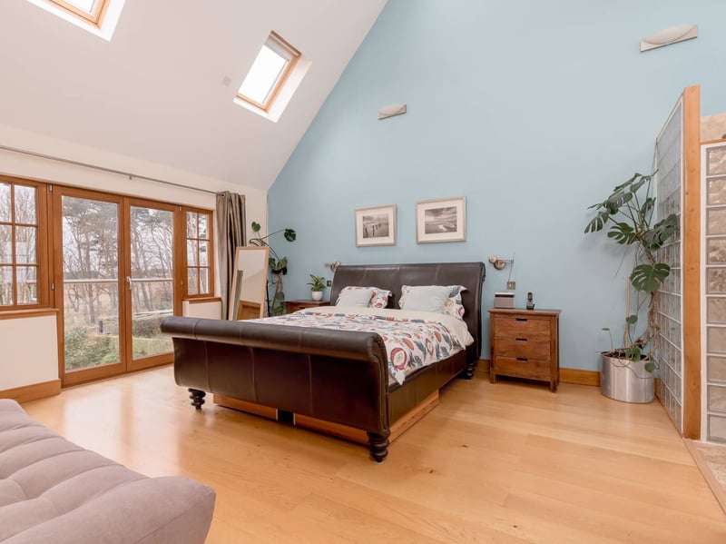 The impressive principal bedroom is a large double with a double height vaulted ceiling, French doors to a Juliet balcony, a separate dressing room and a spacious en-suite bathroom.