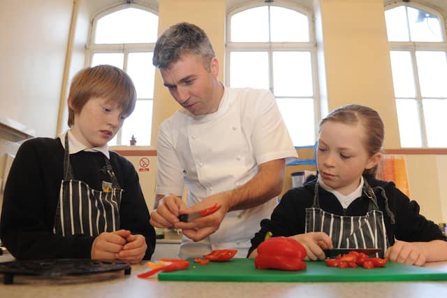 Pupils from Trinity Primary School tried out top Scottish chef Martin Wishart's new family cook school in Edinburgh in November, 2011.