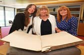 Hannah Clarke, her grandmother Margaret Moloney of Tuam and mother Anne Clarke with the University of Galway student register showing the signature of Hannah’s great-grandmother, Mary C. Whyte