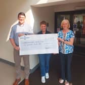 Sharon Scott, centre, Dergview FC treasurer, presents a cheque for £600 to Phillip Haire and Susan Young, committee members of the Castlederg Patient Comfort and Terminally Ill Fund. The funds were raised at the annual John Forsythe Memorial Cup at Darragh Park.
