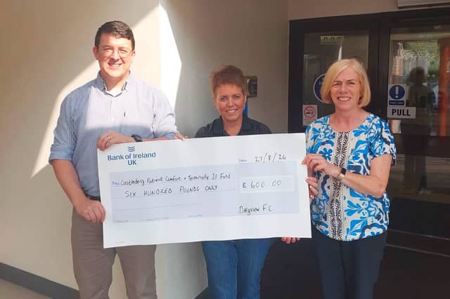 Sharon Scott, centre, Dergview FC treasurer, presents a cheque for £600 to Phillip Haire and Susan Young, committee members of the Castlederg Patient Comfort and Terminally Ill Fund. The funds were raised at the annual John Forsythe Memorial Cup at Darragh Park.