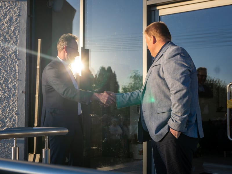 Contractor Steven Kilpatrick hands over the scissors to Moderator Rev Dr Richard Kerr for the ribbon cutting. ST264335
