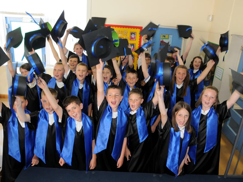Graduating year six pupils from St John Bosco RC School celebrated the school's outstanding Ofsted report in 2011.