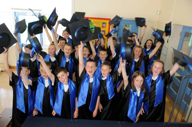 Graduating year six pupils from St John Bosco RC School celebrated the school's outstanding Ofsted report in 2011.