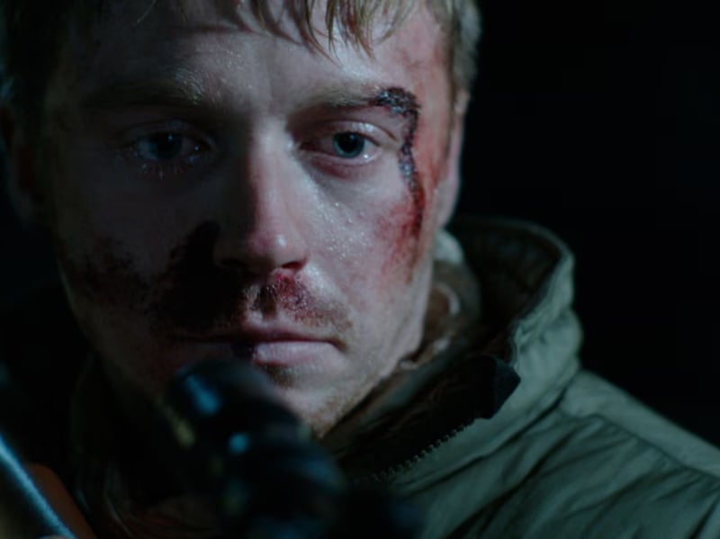 Jack Lowden plays the lead role in Matt Palmer's 2018 Netflix thriller Calibre. A pair of childhood friends travel to a remote area of the Scottish Highlands for a hunting trip, where something very bad happens.