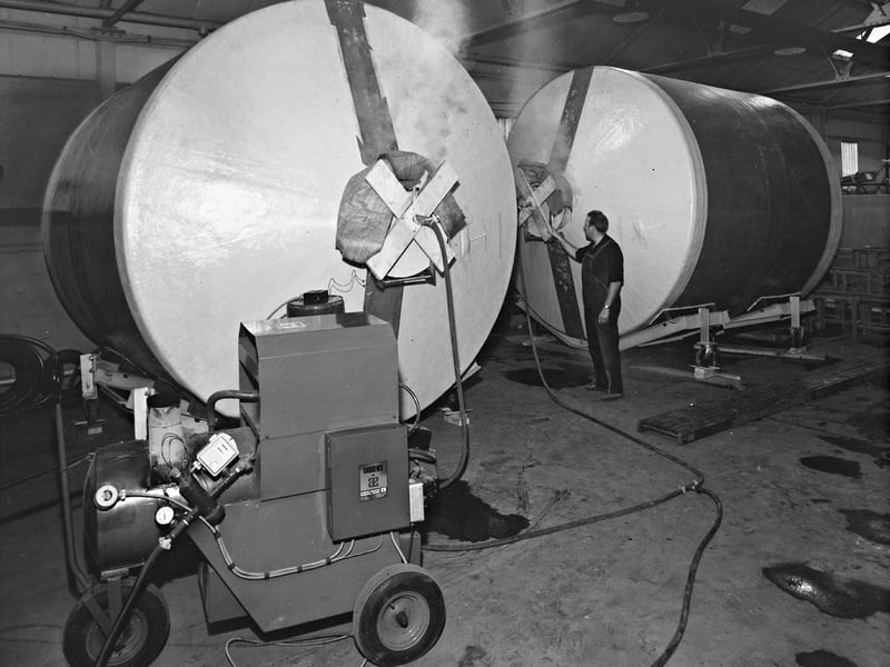 Enormous cylindrical tanks undergo specialised high-pressure steam cleaning in February 18, 1970. Manufactured by Prodorite of Wednesbury using glass fibre, the giant containers held between 5,000 and 10,000 gallons each for a major wine storage project for the Port of London Authority. Before delivery, equipment supplied by Andrews Industrial Equipment of Wolverhampton non-chemically sterilised each tank at 90 degrees for at least three hours, ensuring the vessels were perfectly prepped for bulk wine transport. Do you remember Prodorite or Andrews Industrial Equipment operating across Wednesbury and Wolverhampton? Did anyone in your family work on manufacturing or servicing industrial storage tanks like these back in the 1970s?