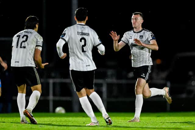 Lee Devitt accepts the congrats of Gianfranco Facchineri and Anthony O'Connor after pulling a goal back for Galway United in Waterford on Monday night.