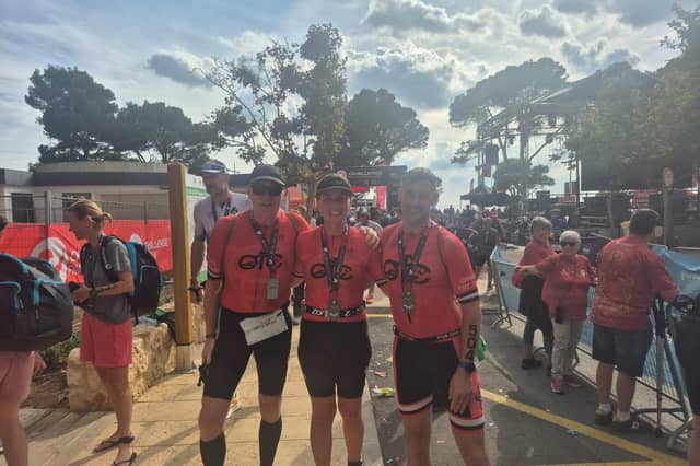 Seamus Arkinson, Meabh, and Ruairi McConnell, pictured at the Challenge Peguera-Mallorca finish line.