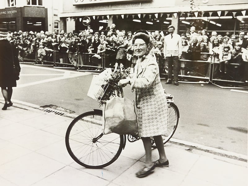 Talk about rolling out the red carpet! Cyclist Miss Constance Jessop gets an unexpected, roaring ovation from the lined crowds as she pedals past the town hall on July 27, 1977. The Moncrieffe Street resident had simply hopped on her pushbike to pop into town for a bit of everyday shopping, completely oblivious to the fact that the main roads had been sealed off in eager anticipation of Queen Elizabeth II's Silver Jubilee visit. Finding herself pedalling right down the grand procession route, Miss Jessop took it all in stride, playing along with a wave and proving that every town needs its own surprise cycling royalty!