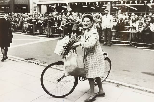 Talk about rolling out the red carpet! Cyclist Miss Constance Jessop gets an unexpected, roaring ovation from the lined crowds as she pedals past the town hall on July 27, 1977. The Moncrieffe Street resident had simply hopped on her pushbike to pop into town for a bit of everyday shopping, completely oblivious to the fact that the main roads had been sealed off in eager anticipation of Queen Elizabeth II's Silver Jubilee visit. Finding herself pedalling right down the grand procession route, Miss Jessop took it all in stride, playing along with a wave and proving that every town needs its own surprise cycling royalty!
