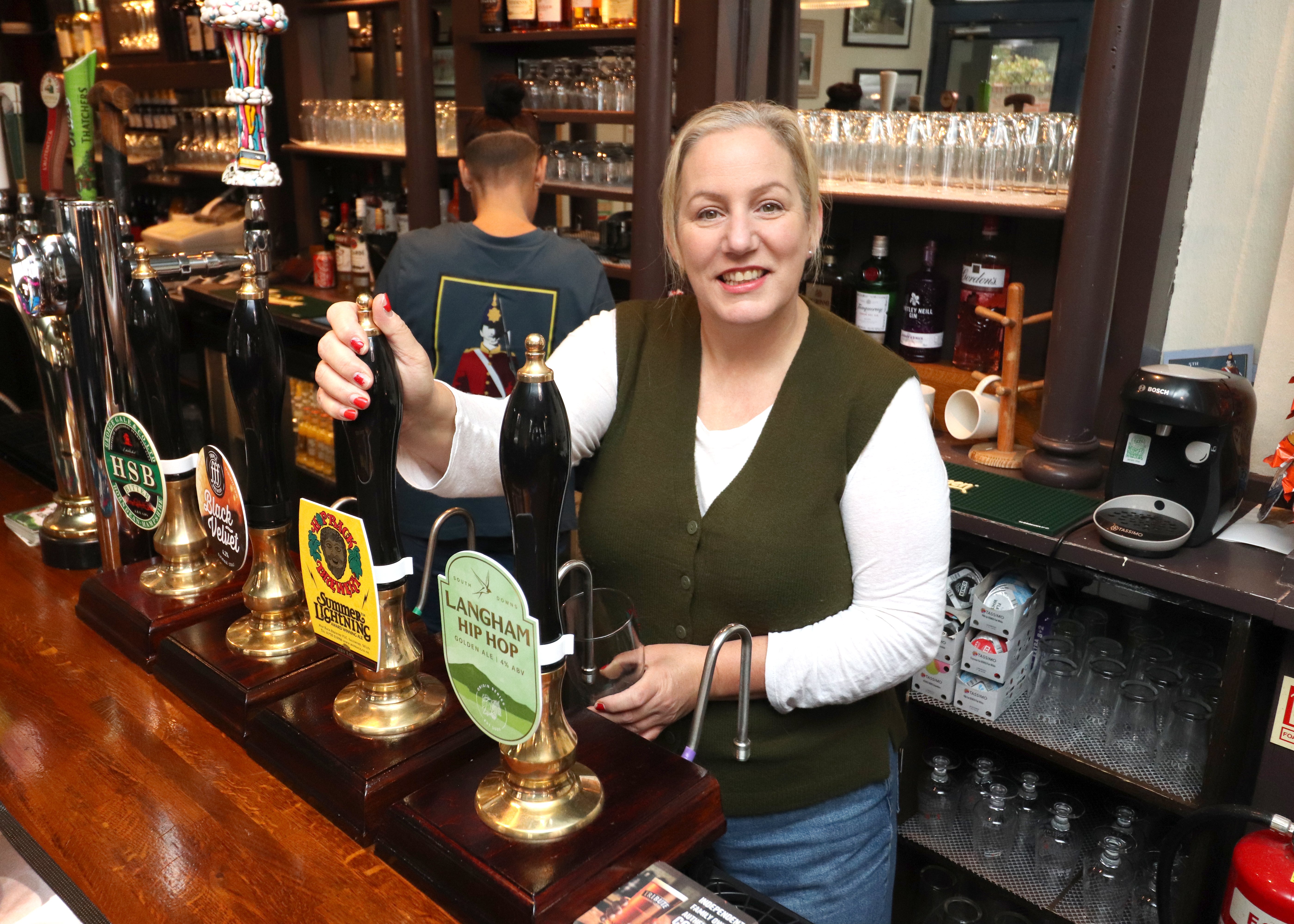 Landlady Ally Wearn pouring a pint on Tuesday, October20.

