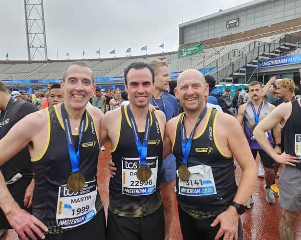 Omagh Harriers' Martin McIvor, Darrell Brogan and Ricky Duffy delighted after the Amsterdam Marathon.