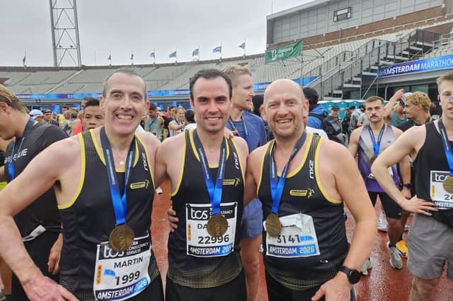Omagh Harriers' Martin McIvor, Darrell Brogan and Ricky Duffy delighted after the Amsterdam Marathon.