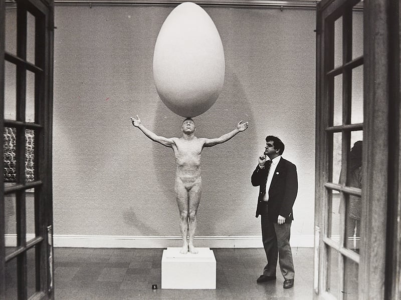 An egg-straordinary piece of modern art. In April 1993, Wolverhampton Art Gallery attendant Vernon Wilson, from Parkfield, strikes a thoughtful pose as he contemplates a striking, life-size sculpture by artist Malcolm Poynter. Featuring a figure balancing a massive egg on its head, the eye-catching installation added a wonderfully surreal and playful buzz to the gallery during its spring exhibition.