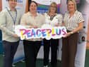 Peaceplus management team alongside Fermanagh and Omagh District Council chairwoman, Cllr Debbie Coyle. SU0842CD26