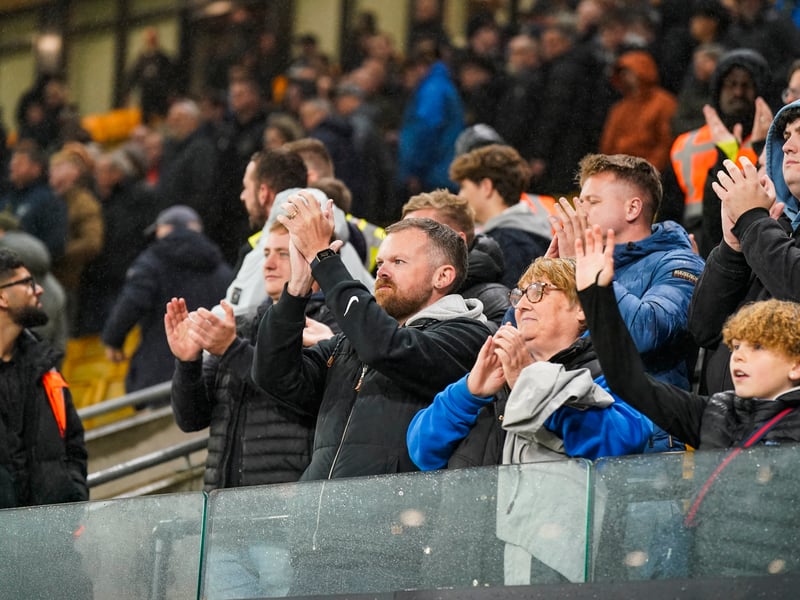 Celebrating a share of the points at the full-time whistle.
