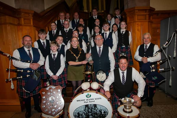 The Mayor of Derry City and Strabane District Council, Grace Ui Niallais, pictured at the Guildhall making a presentation to the Bready Ulster Scots Pipe Band on being crowned world champions 2026 in Grade 4B at the World Pipe Band Championships, and for securing the title of World Champion Drum Corps, Grade 4B.
