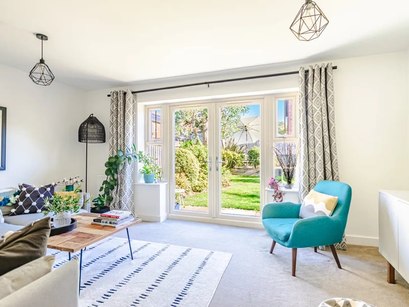 An alternative view of the bright rear living room, perfect for lounging.