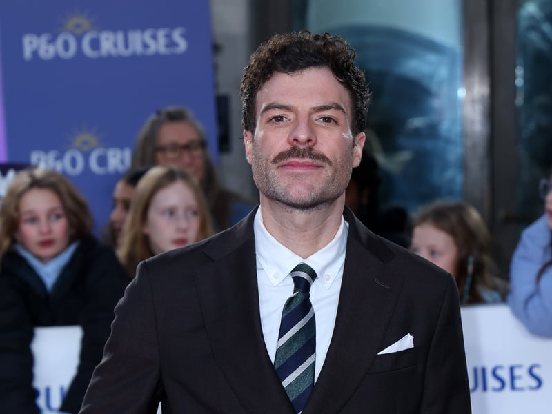This radio and TV presenter grew up in Burnley and Preston. He has been the host of Captial Breakfast since April 2024, having previously worked at BBC Radio 1, and has also co-presented the podcast Help I Sexted My boss since March 2018.