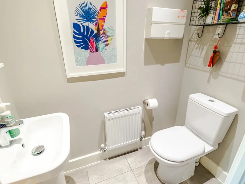 Off the hallway is a convenient downstairs w/c with wash hand basin, and a handy under stairs storage cupboard.
