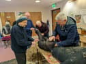 Scarecrow makers from Park Men's Shed hard at work.