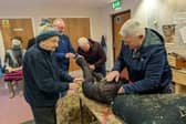 Scarecrow makers from Park Men's Shed hard at work.