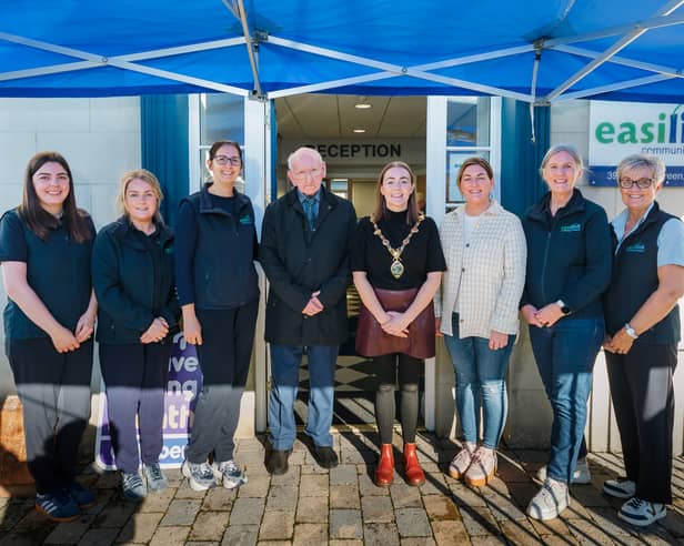 Mayor of Derry City and Strabane District Council, Grace Uí Niallais, pictured with Easilink staff at their new premises in Strabane.