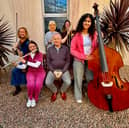 Musicians from South Ulster Sinfonia who will play at Tannaghmore PS on November 14, 2026 pictures with the orchestra's musical director, Philip Walton (seated) and leader for this concert, violinist
