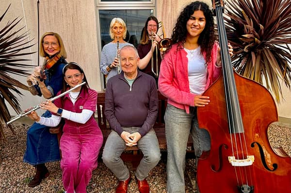 Musicians from South Ulster Sinfonia who will play at Tannaghmore PS on November 14, 2026 pictures with the orchestra's musical director, Philip Walton (seated) and leader for this concert, violinist