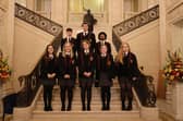 Marcas, Raimondas, Riquelme, Vyte, Alex, Amy, Caitlin and Grace are pictured on the stairs of Parliament Buildings during their visit to Stormont.