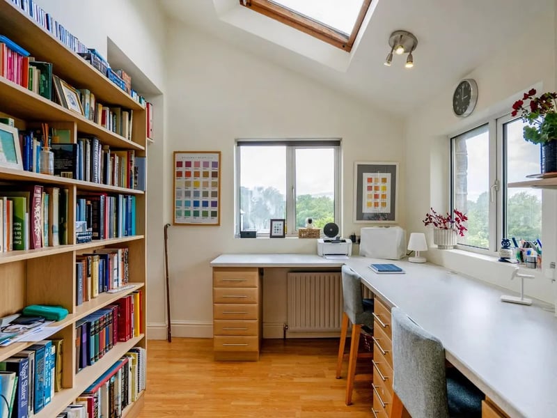 It hosts a modern study overlooking the quaint surrounding countryside. 
