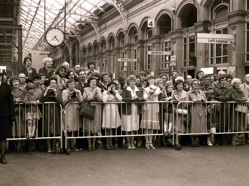 1980. Crowds await the arrival of the Queen at Preston Station
