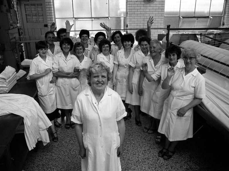 1980. One of the ladies of Preston Royal Infirmary laundry gets a send off from collegues on her retirement