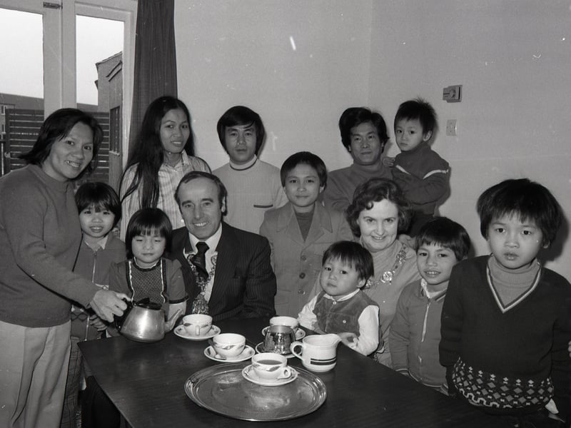 Enjoying a great British occasion with Preston's mayor, Coun Dennis Kehoe, were these two families of Vietnamese boat people, who had just moved into their new home in Marlefield Close, Ingol. The homes were provided jointly by Preston Council and the Central Lancashire Development Corporation