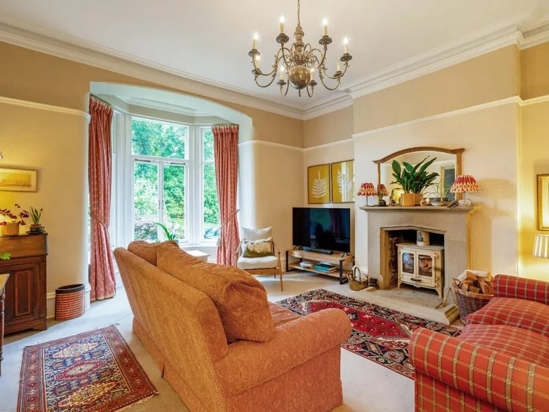 The first of the two living spaces, centred around a roaring wood-burning stove.