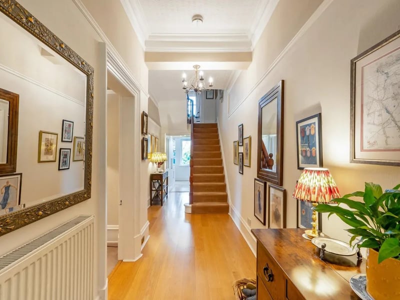 The entrance floor has a spacious hallway, providing a warm welcome for visitors.