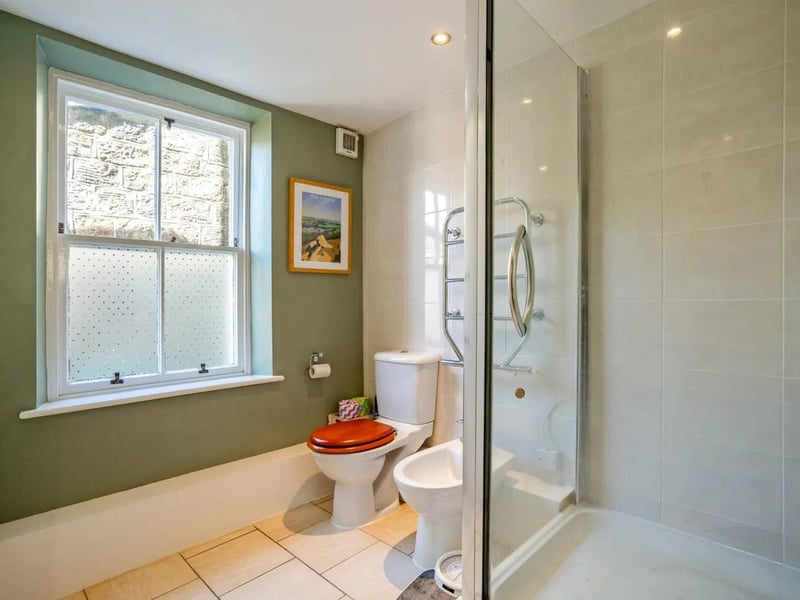 Adjacent to the conservatory is a useful shower and WC.