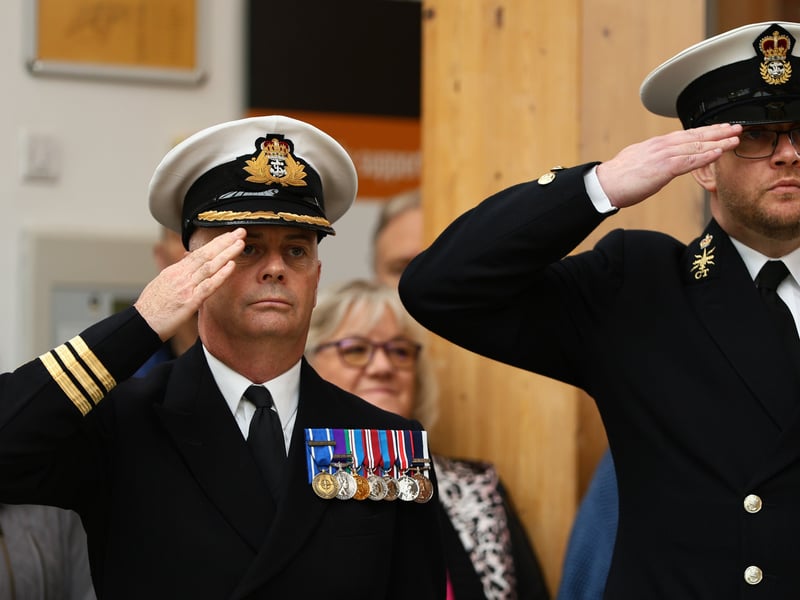Cdr Steve May of HMS Collingwood, left, during The Last Post.