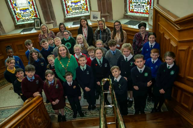 The Mayor of Derry City and Strabane District Council, Grace Ui Niallais, pictured with local primary school children, who took part in Local Democracy Week events at the Guidlhall. Included are some of the teachers and classroom assistants.