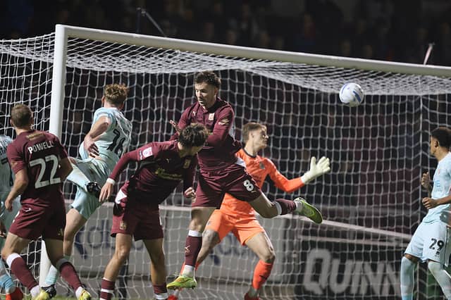 Bobby Faulkner's header flies past Zach Jeacock and nestles into the corner