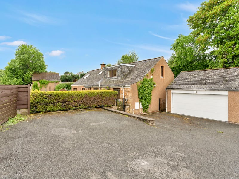 Externally, the property benefits from a private drive area and a large garage that can accommodate two cars. It also has fully-enclosed gardens to the front, side, and rear.