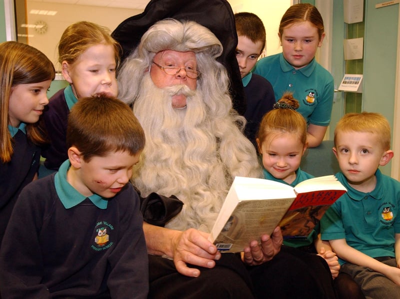 Children were treated to a reading of the latest Harry Potter book 21 years ago, and this character arrived to read to the pupils in the new library.
