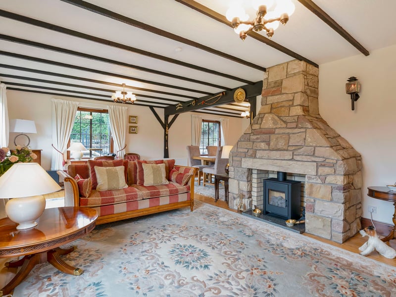 The living and dining rooms share an expansive open-plan layout set in an L-shape to allow each section its own sense of space. It easily accommodates comfy lounge furniture and a large table for eight people (or more). Dual-aspect windows to the southwest and southeast ensure a daily flood of natural light, while patio doors extend the room out into the front garden.