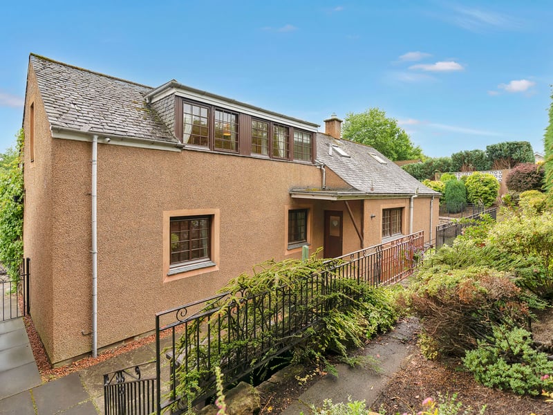 The side garden provides a sizeable patio for summer dining before continuing to the rear, which is layered in two tiers with mature shrubs for a leafy backdrop. Altogether, it ensures an air of tranquillity and plenty of outdoor space for families.