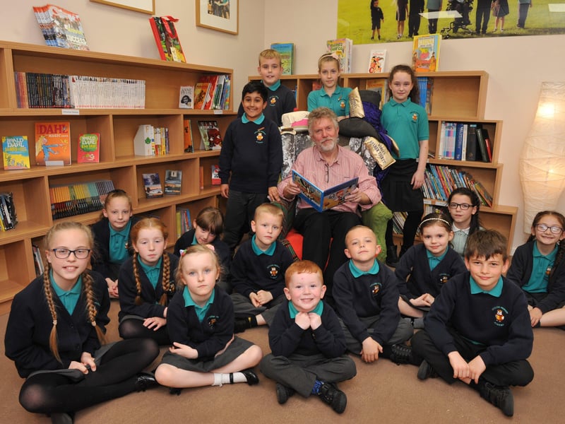 Storyteller Tony Wilson had lots of company on the day that he opened Oxclose Primary Academy's new library with pupils.