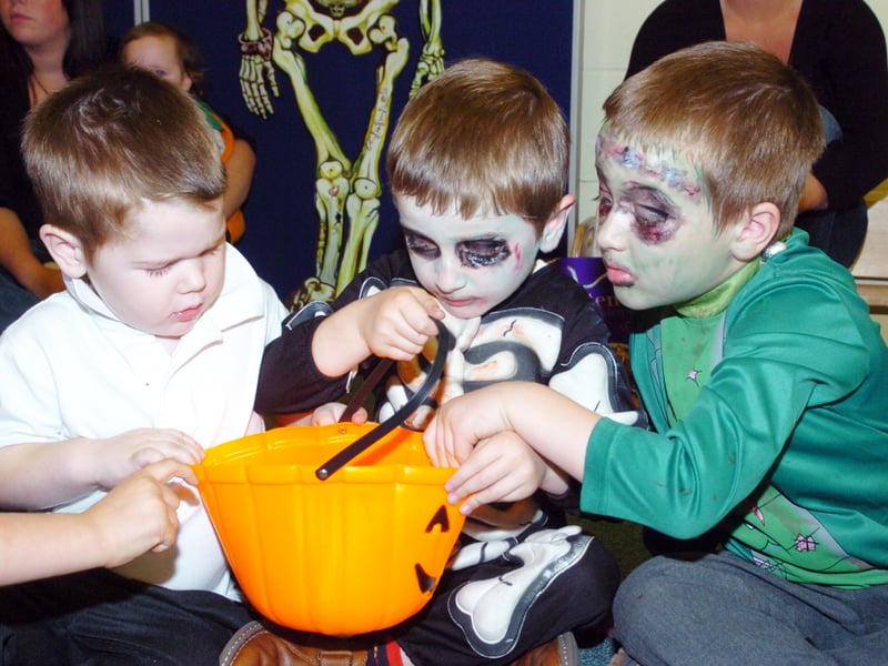 Passing the parcel during a Halloween Party at St James' Central Children's Centre are L-R Cain Evans, three, of Balby, Patrick Beresford, five, and brother Finlay, six, of Hyde Park. 