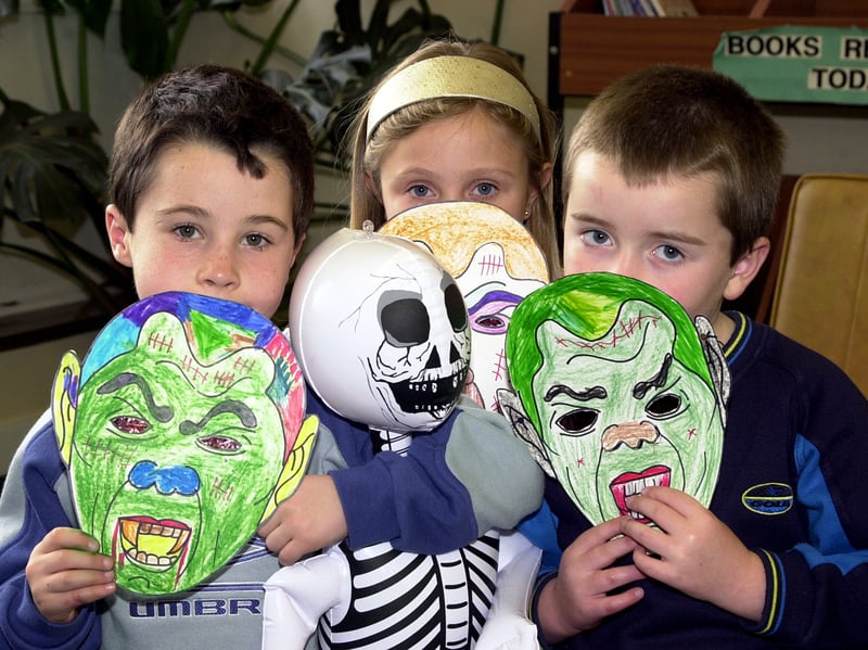 28/10/2002 

Scary, or what: Mask makers, from left, Tom McMahon, aged seven, Danielle Taylor, aged eight, and Matthew Guy, aged six, pictured with Halloween masks at Sprotbrough Library.
