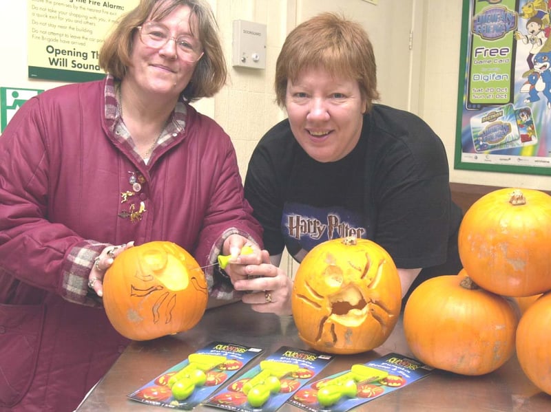 Halloween Challenge . Mrs Violet Bushall tries her hand at making a perfect pumpkin lantern with Carcroft ASDA Events Co ordinator  GraceCurtis (right) October 27 2001.