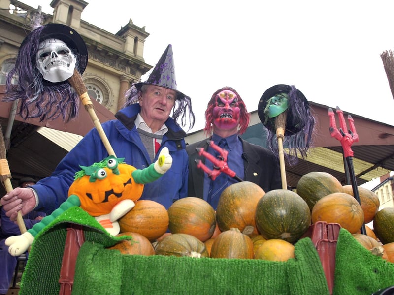 Market traders Roy Penketh (left) and Mick Maye, treasurer and president respectively of the Doncaster branch of the Market Traders Federation, get in the Hallowe'en mood with pumpkins, masks, brooms and forks. 
